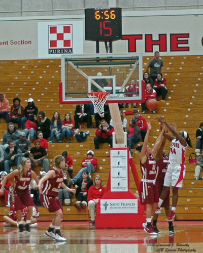 Nikkia Smith shoots over the outstretched arms of BC's Kristen Doherty